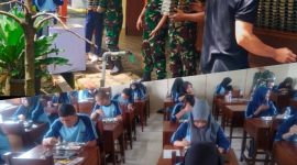Anggota Kodim Pati nampak sedang membantu pendistribusian program MBG disejumlah sekolah di Pati.