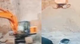 Alat berat jenis Eksavator 200 -250 PK nampak sedang beroperasi di lokasi penambangan/galian C.