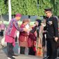 Kapolres Jepara AKBP Erick Budi Santoso didampingi Ketua Bhayangkari Cabang Jepara Ny. Dessy Erick Budi Santoso, saat menghadiri acara upacara peringatan hari jadi Kabupaten Jepara ke-476.