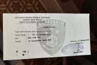 Surat tanda terima laporan polisi.